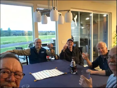 Members seated around a table at a restaurant