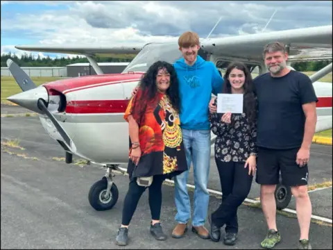 Jazmin with her mom, CFI Daniel Weaver and her dad