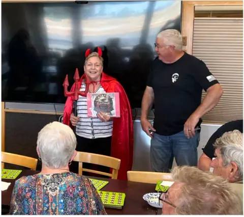 Jeanne Hansen sporting the EAA Chapter 430 chili cook-off, perpetual trophy uniform