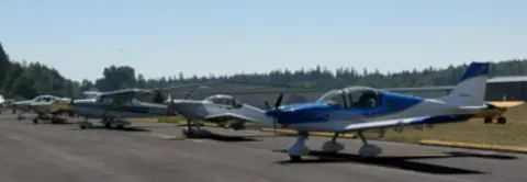 Fly-out airplanes parked on the ramp at Jefferson County International