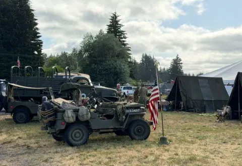 Military jeep and tents at a World War II encampment display