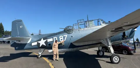 Dave standing beside the TBM Avenger torpedo bomber