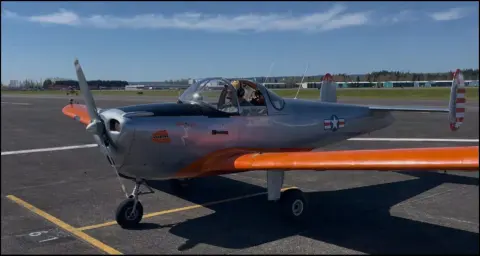Kevin’s silver and orange Ercoupe on the ramp
