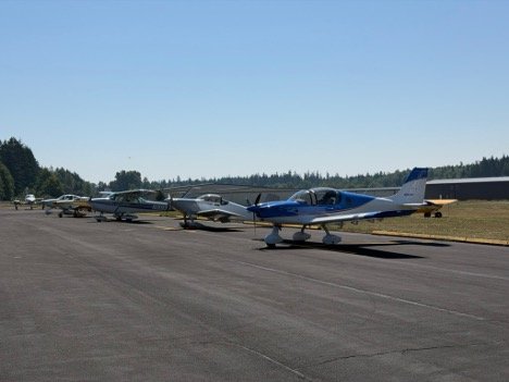 Fly-out airplanes parked on the ramp at Jefferson County International